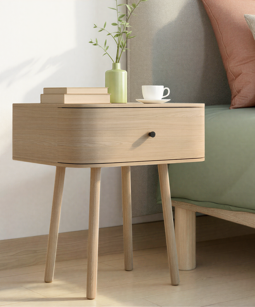 Wooden bedside table with a drawer, cup, and vase in a room setting.
