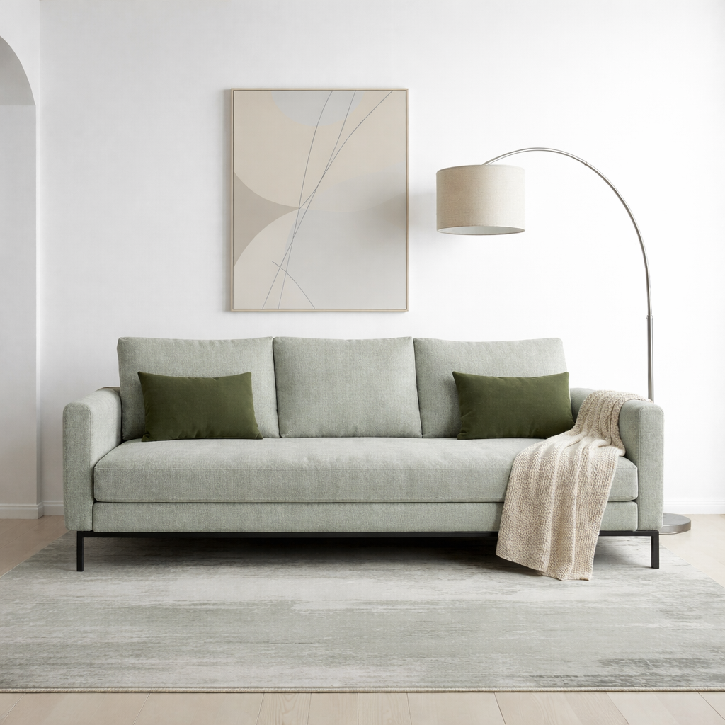 Green modern 2 seater sofa in a modern minimalist living room. 