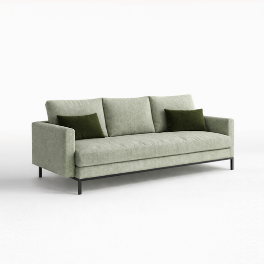 Gren sofa with green cushions on a white background