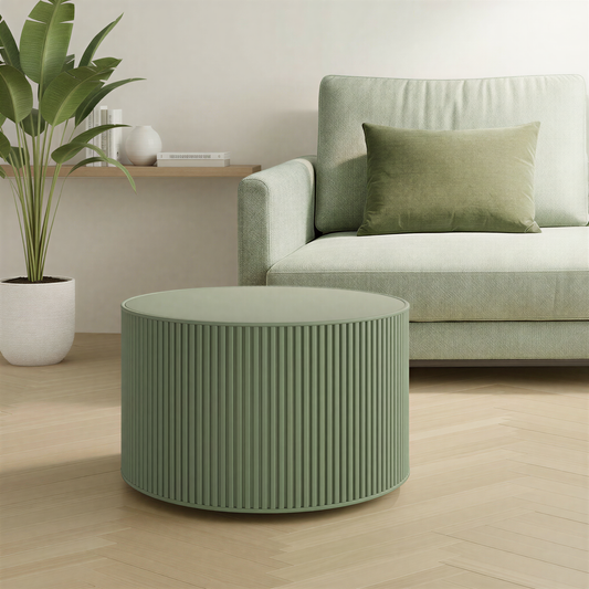 Green coffee table in a living room with a sofa and plant