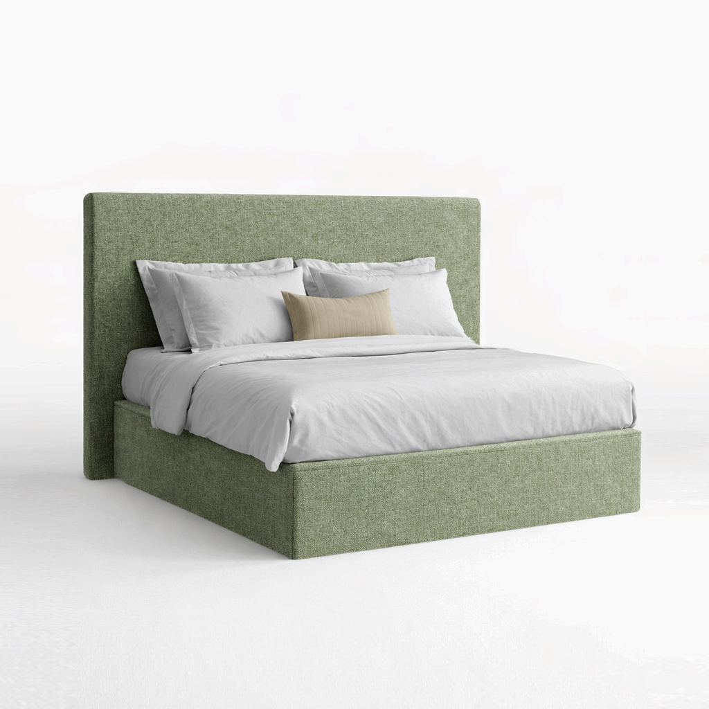 Green upholstered bed with white bedding on a white background