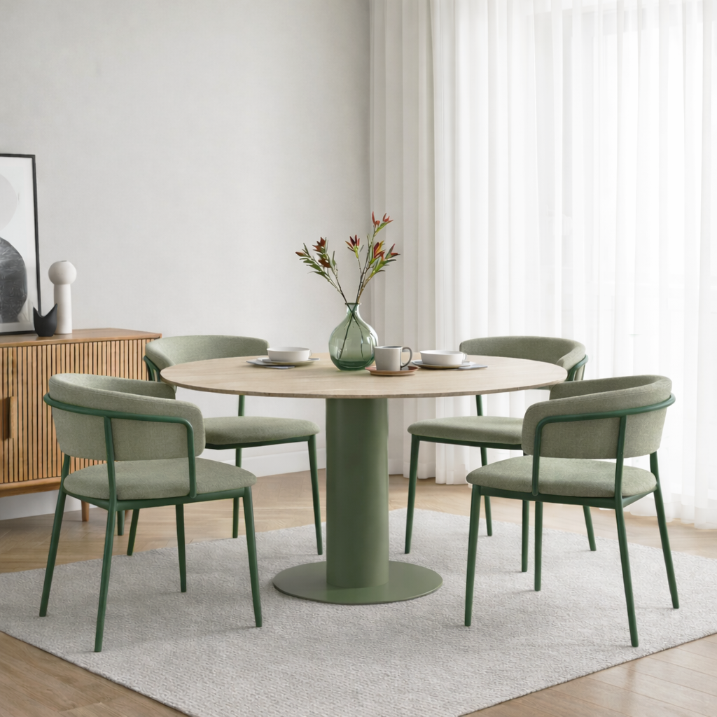 Round dining table with four chairs in a modern room setting.