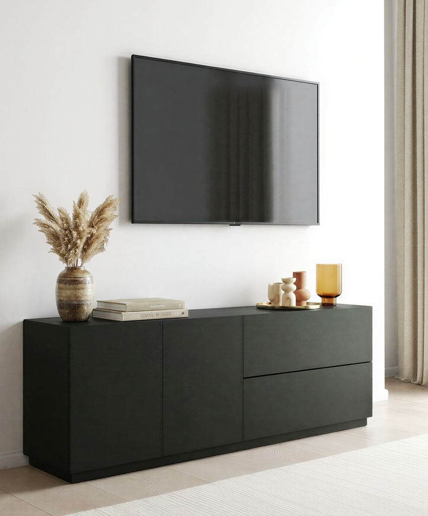Modern black tv unit with decorative items against a white wall