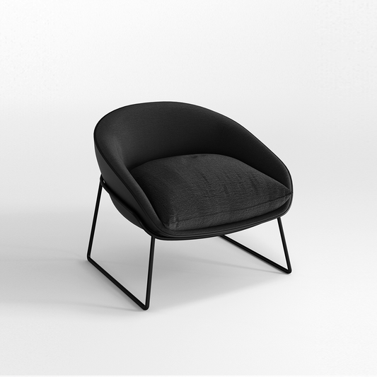 Black armchair with a cushion on a white background
