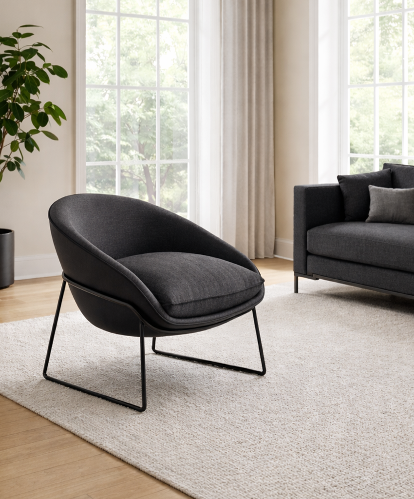 Modern living room with a black armchair and sofa.