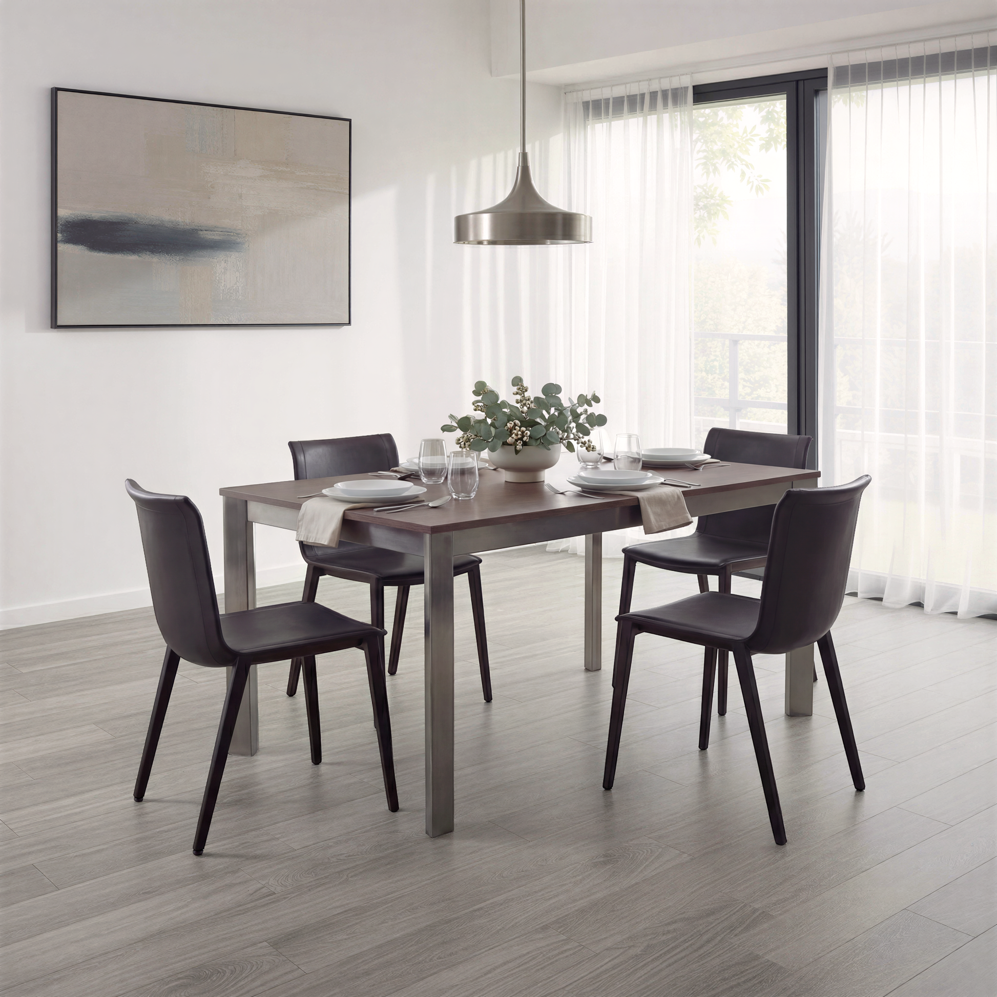 Sophisticated dining room showing black leather chairs sat around a walnut dining table with dark chrome frame.