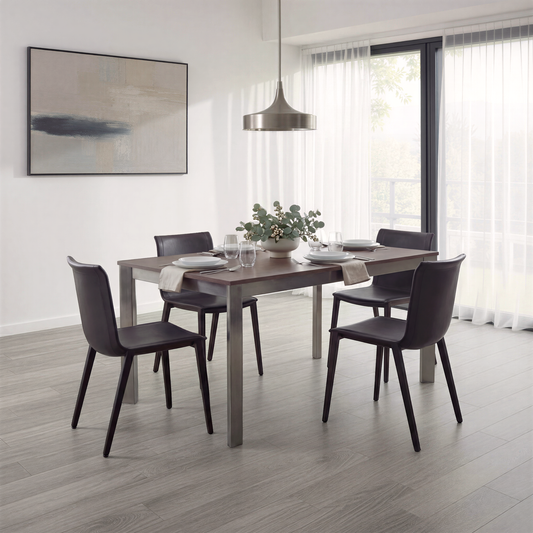 Sophisticated dining room showing black leather chairs sat around a walnut dining table with dark chrome frame.