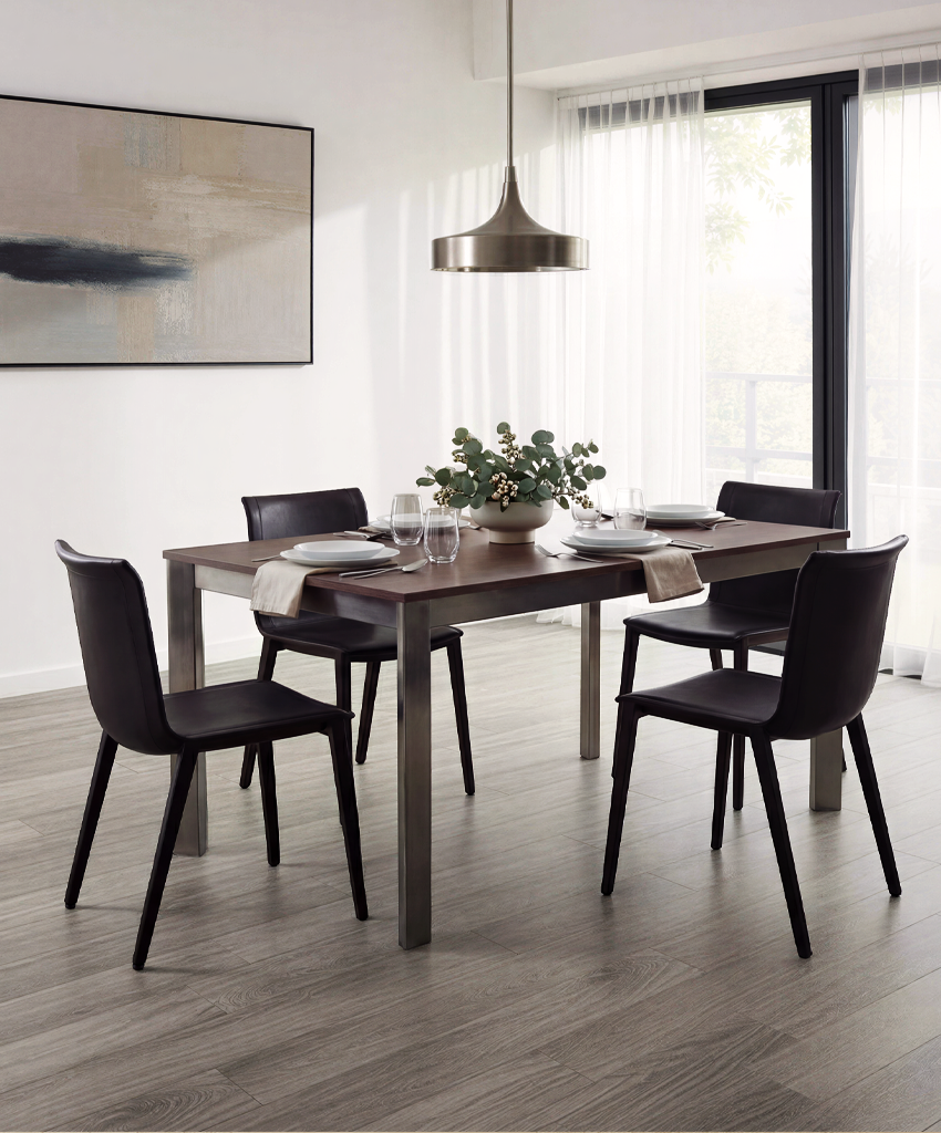 Dining room with a wooden table and 4 chairs, set for a meal.