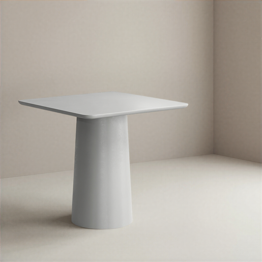 Minimalist grey dining table with a cylindrical base against a plain background