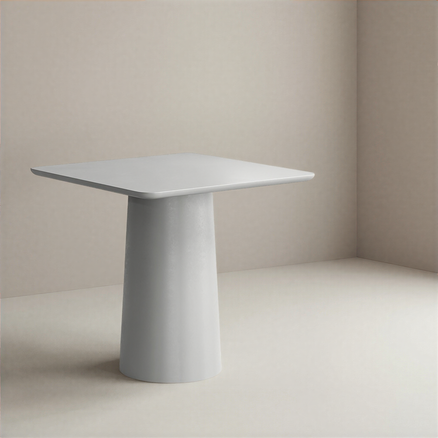 Minimalist grey dining table with a cylindrical base against a plain background