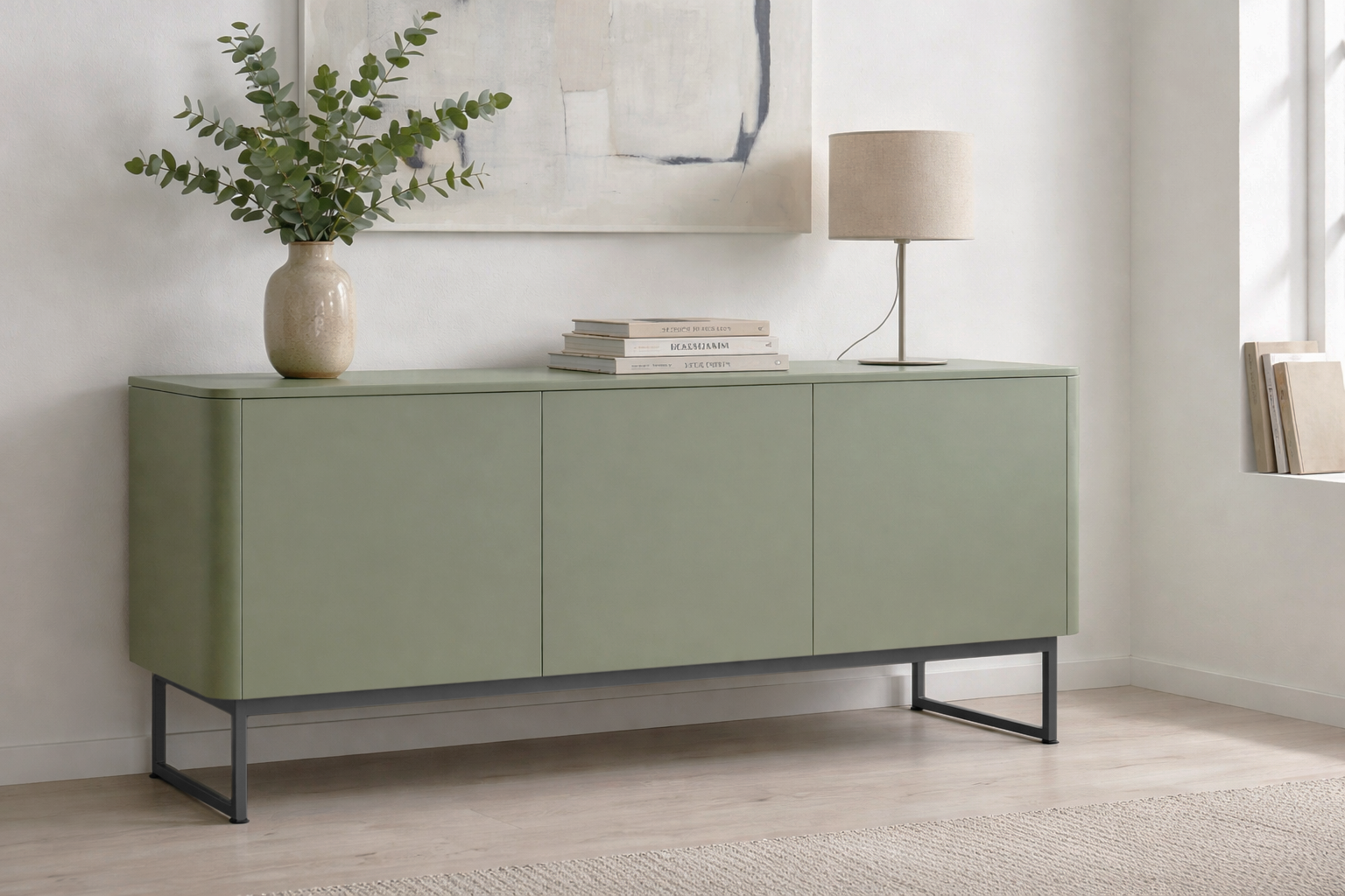Green tv unit in a room with a lamp, books, and a plant.