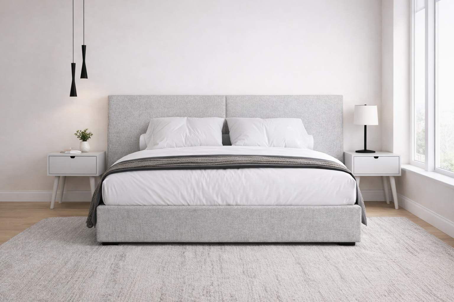 Modern bedroom with a grey upholstered bed, light grey nightstands, and minimal decor.