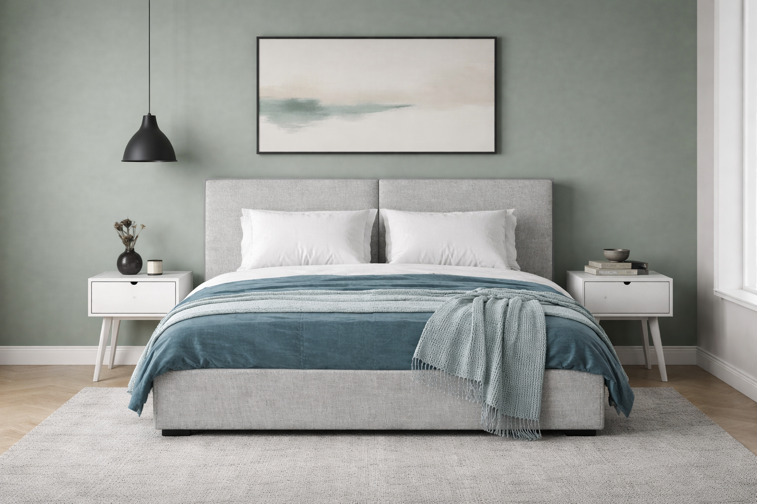 Grey upholstered double bed with grey nightstands in a modern bedroom.